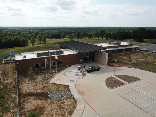 Completed white reflective PVC roof on a commercial building