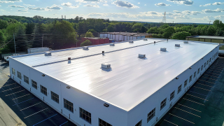 Completed white TPO roof on a DFW commercial building