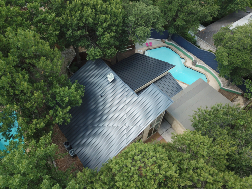 Greenleaf Roofing crew installing an IKO asphalt shingle roofing system in DFW