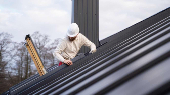 Close-up of standing seam metal roof panel seams showing concealed fastener design